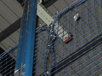 Offset mount mesh safety netting for pallet rack